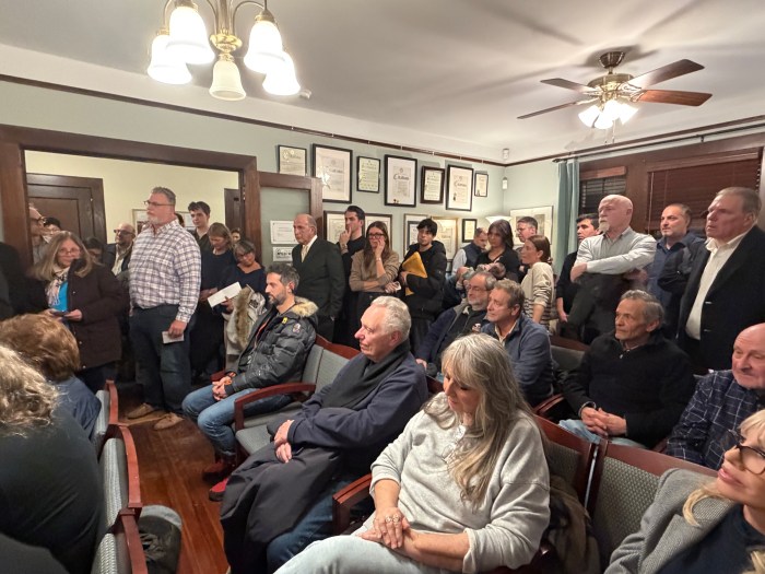 Residents packed village hall for the public hearing on the proposed headquarters. 