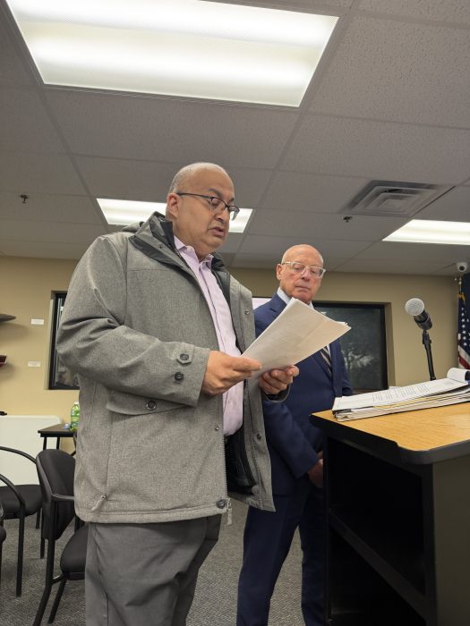 Bombay Kitchen owner Sanjiv Mody (L.) and attorney Michael Sahn (R.) spoke at the village meeting, asking for an extension for a conditional use permit for operations at Bombay Kitchen.