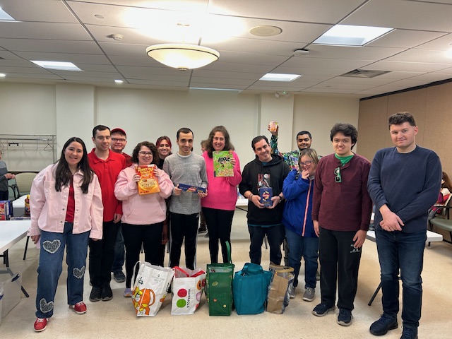 Women’s Club of Farmingdale stuffs grocery bags to give to students during the February break