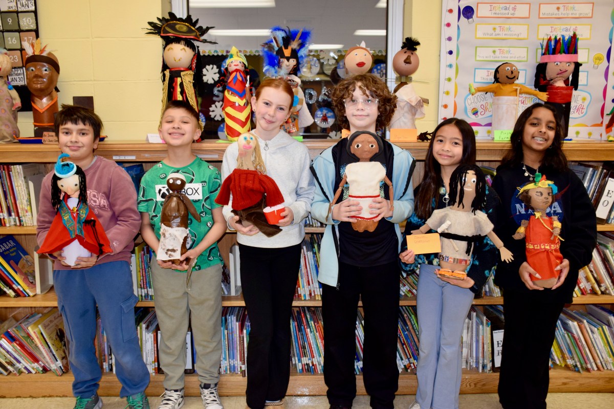 John Lewis Childs School fifth graders are pictured with their pop bottle projects.