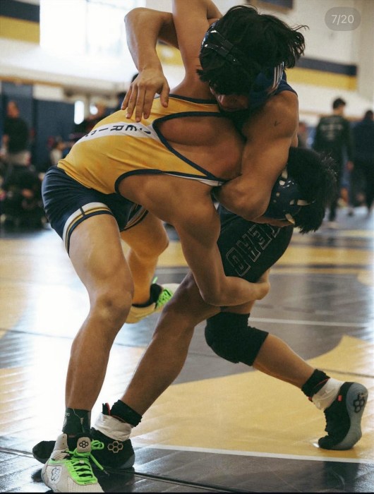 High school wrestlers competing at the 2026 Nassau County qualifier tournament hosted by Jericho High School.