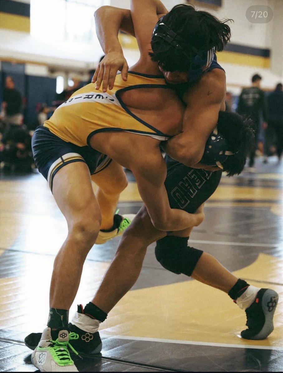 High school wrestlers competing at the 2026 Nassau County qualifier tournament hosted by Jericho High School.