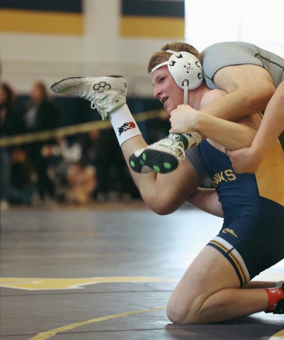 High school wrestlers competing at the 2026 Nassau County qualifier tournament hosted by Jericho High School.