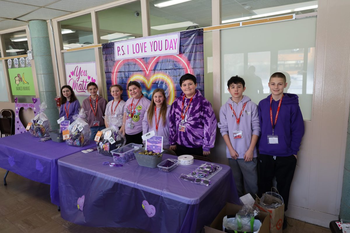 Outside the Salk Middle School cafeteria, students sold P.S. I Love You Day-themed items.