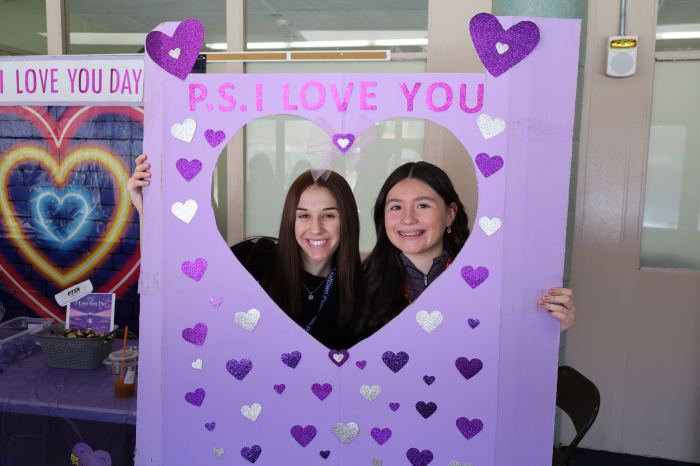 Family and consumer science teacher Molly Neary and sixth grader Maryann Munar posed in Salk’s photo booth.