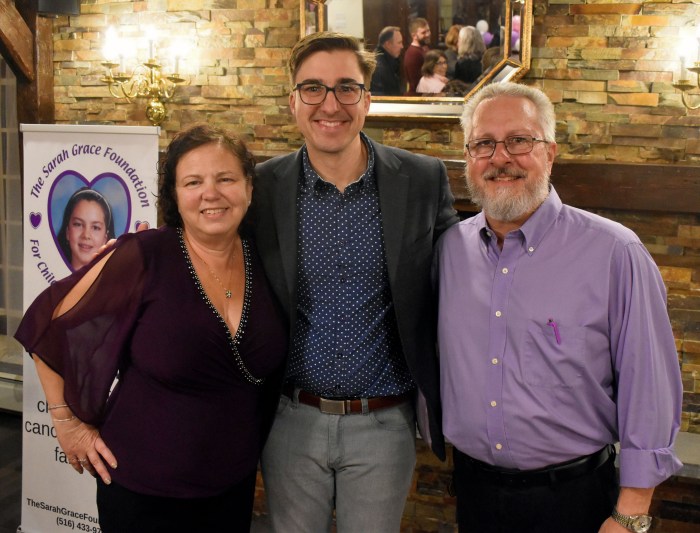 Marissa and Matt Weippert, founders of The Sarah Grace Foundation for Children With Cancer, with magician Gary Gary Ferrar (center) at the 2025 “An Evening of Magic” fundraiser.