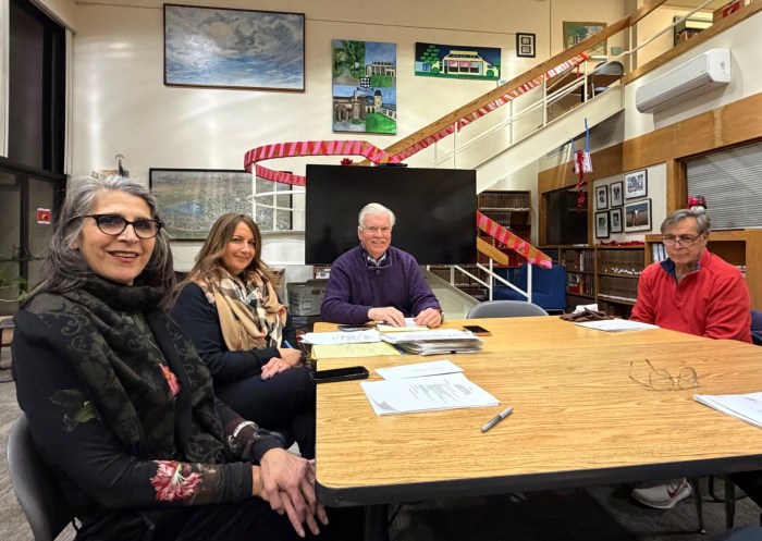 The Village of Matinecock Board of Trustees (from L. to R. Trustee Linda Berke, Village Treasurer Jennifer A. Zoufaly, Village Attorney Peter MacKinnon, and Trustee Robert Marmorale) convened on Tuesday, Feb. 10, at the Portledge School in Locust Valley with updates on the Thorne Lane drainage project.