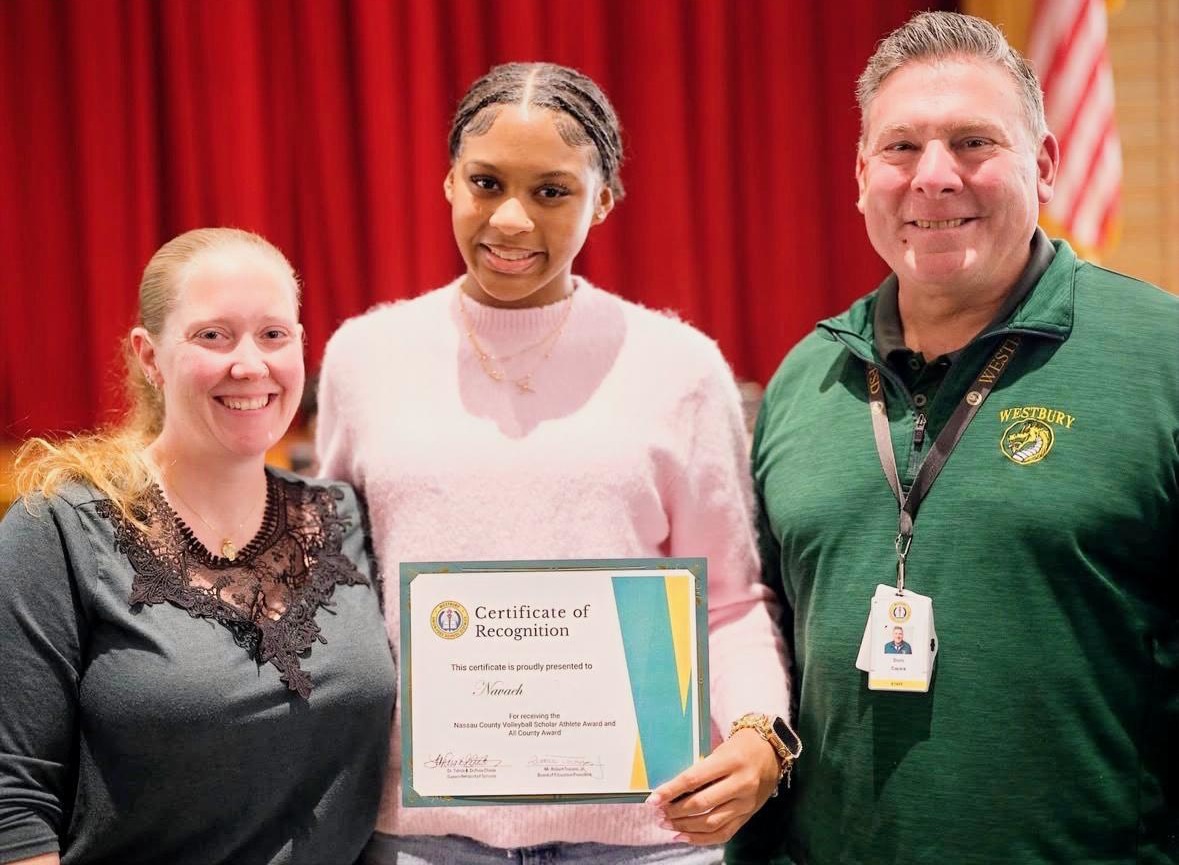 Westbury High School volleyball player Nevaeh Moody (center) was awarded a 2025 Nassau County Scholar-Athlete certificate by her volleyball coach Jaclyn Bedraud (L.), and the athletic director, Doric Capsis (R.)