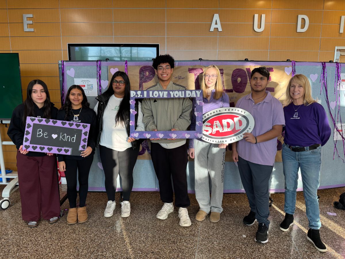 Students from the Students Against Destructive Decisions Club, and guidance counselor Kelly Dass (R.), wore purple on P.S. I Love You Day.
