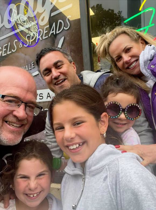 Goody’s Bagels & Spreads owner Peter Goodman (left) with his friends, the Fortunoff family, at the new Goody’s in Jericho.
