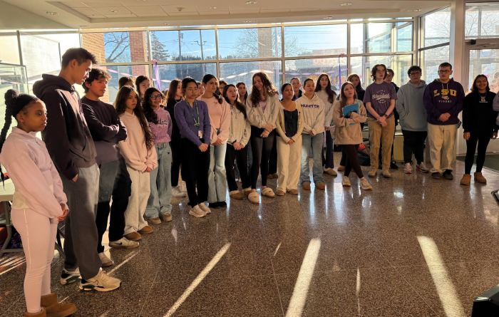 The high school chorus performed at the start of the event.