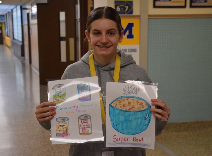 Seventh grader Siena Armato used her artistic talents to make posters that promoted thefood drive.