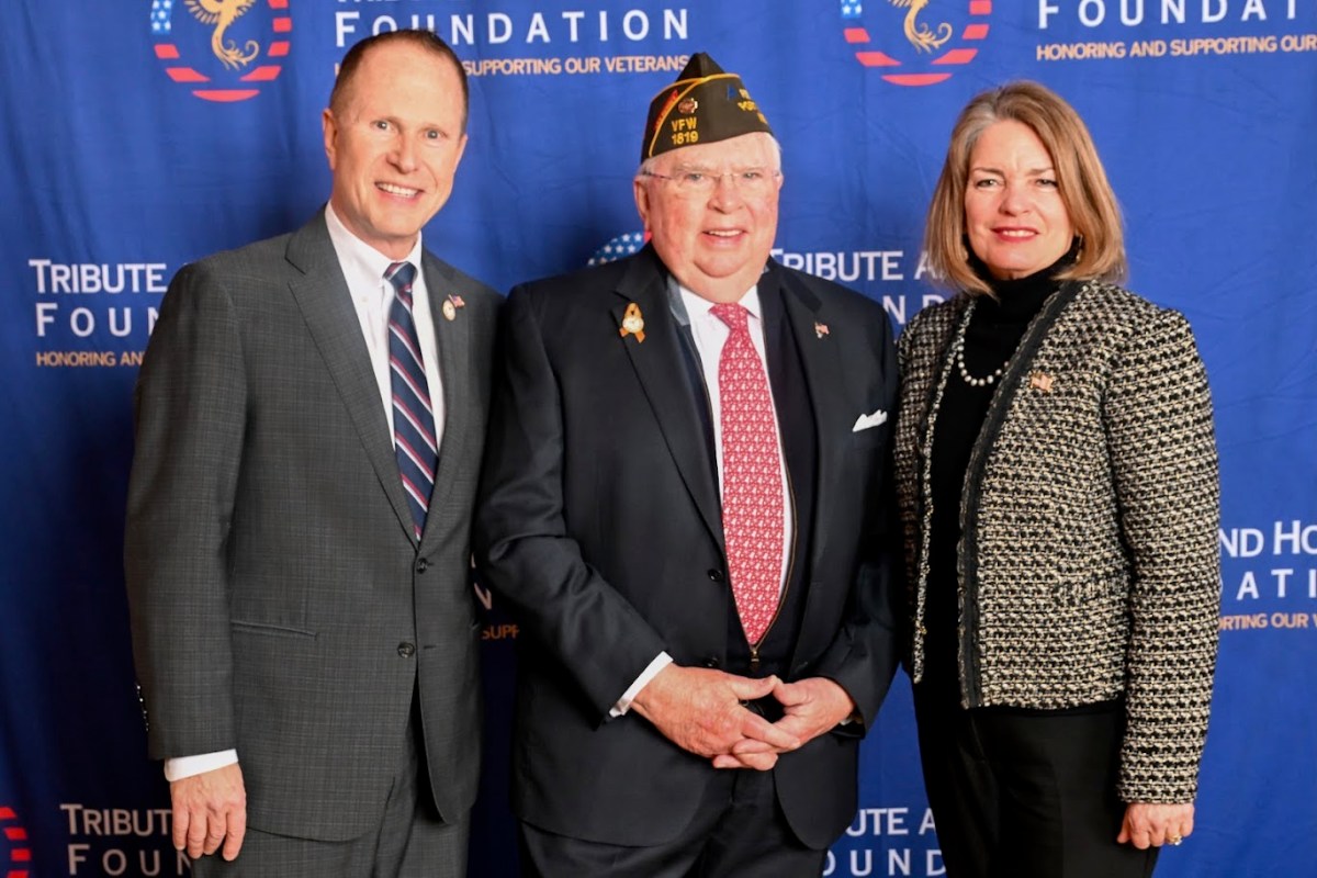 Robert Freeland (C.), Commander of Henderson-Marino VFW Post 1819 in Port Washington and recipient of the Volunteer Award, is joined by Gaitley Stevenson-Mathews (L.), president and founder of the Tribute and Honor Foundation, and North Hempstead Supervisor Jennifer DeSena (R.) following the ceremony.