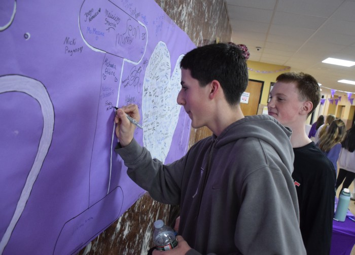 Frankie McCartney (L.), and Sal Tirro (R.) signed the P.S. I Love You Day banner.