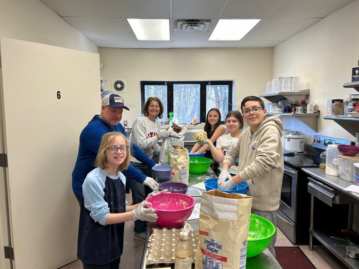 Volunteers baking hamantaschen, the triangular cookies traditionally eaten on Purim during last years event.