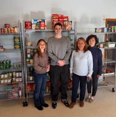 Volunteers Donna Meth, Joseph Vernice, Director of Parish Social Ministry Roxana Sienko and Carrie Cheung in the St. Peter Alcantara Food Pantry.
