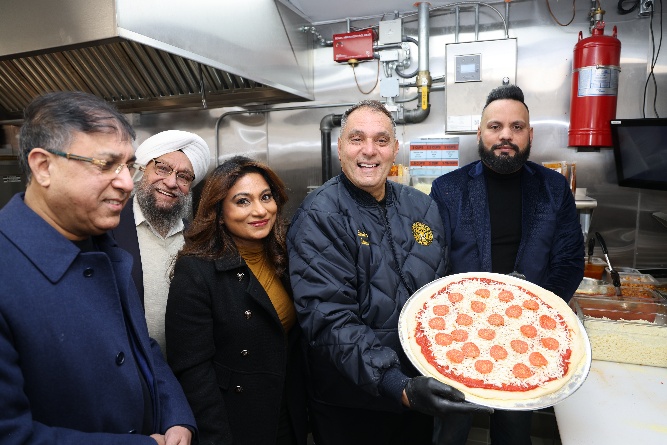 Oyster Bay Town Supervisor Joseph Saladino (2nd from L.) visits new pizza place.