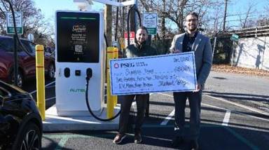 Jerry Pagoulatos (L.), Sunrise Diner owner, and Paul DiBenedetto (R.), PSEG Long Island Electric Vehicle program manager as the diner received a $252,000 rebate for installing an electric vehicle charger.