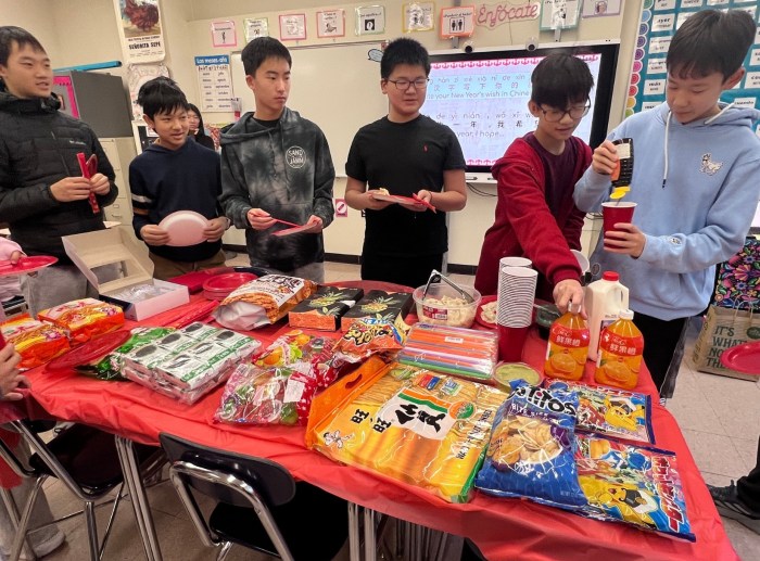 Manhasset students eating Chinese and Taiwanese snacks for Lunar New Year