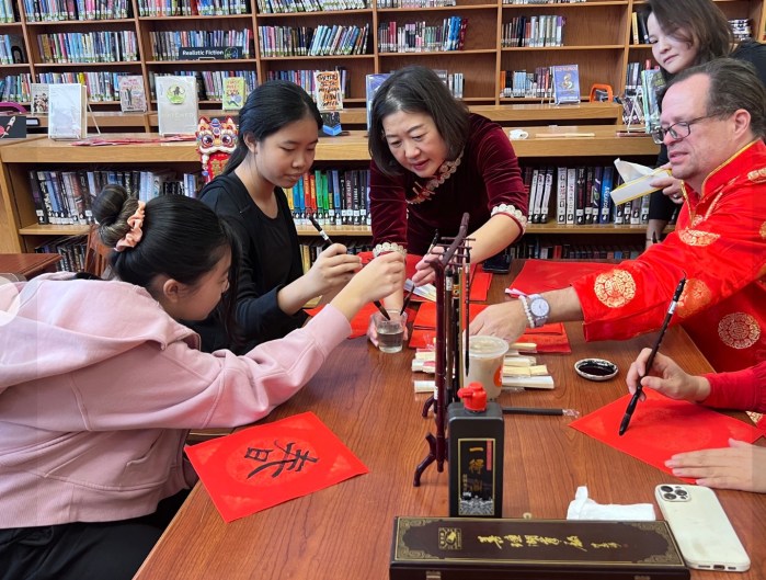 Manhasset students practicing Chinese calligraphy for Lunar New Year