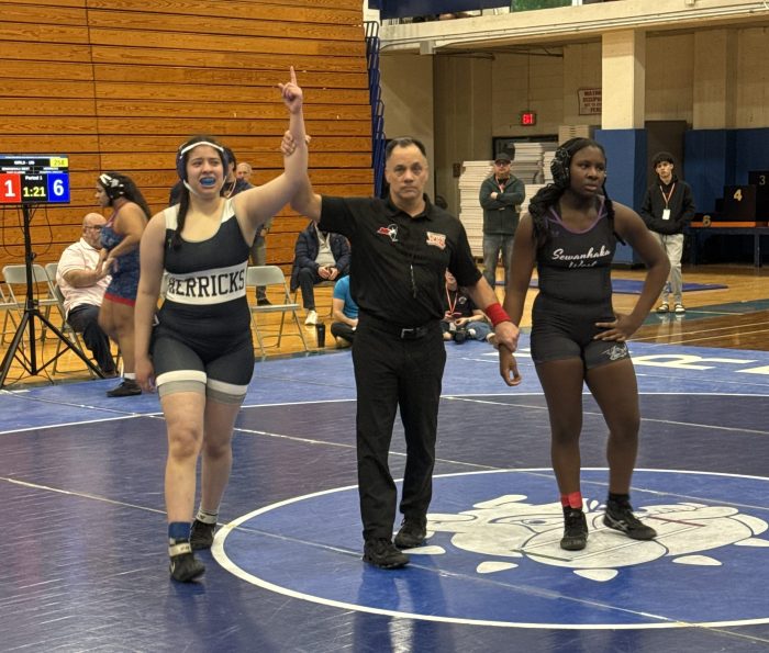 Ayasophia Abdrabo (L.) is a sophomore at Herricks High School, and walked away victorious at the Nassau girls' wrestling tournament.