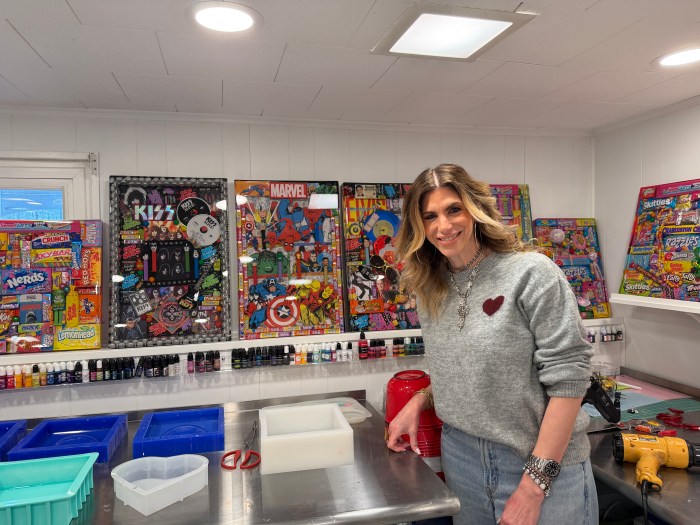 Artist Lori Kingsley in her basement, where she works on her art pieces.
