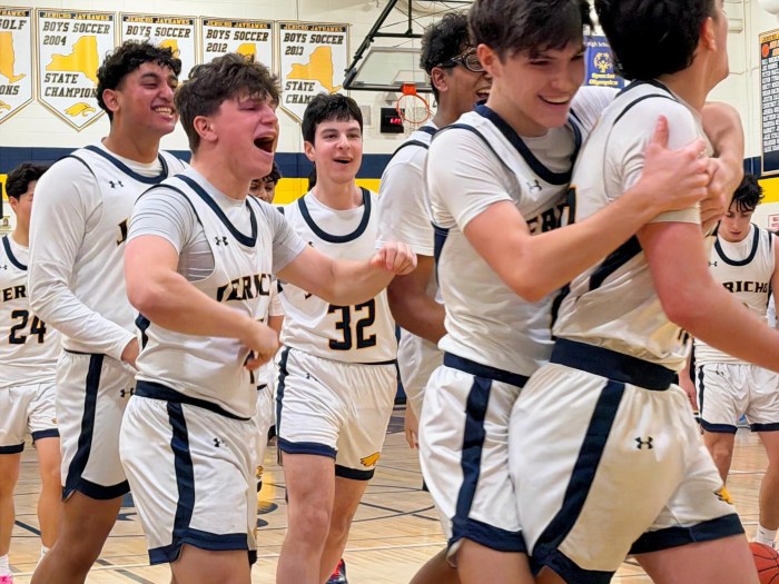 The Jericho Jayhawks celebrate their last-second playoff win over the Bethpage Golden Eagles.