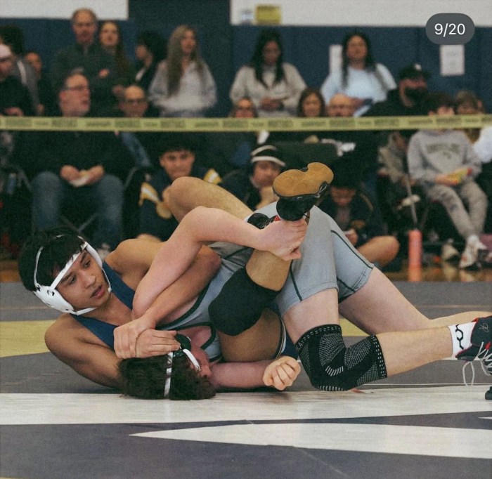 High school wrestlers competing at the 2026 Nassau County qualifier tournament hosted by Jericho High School.