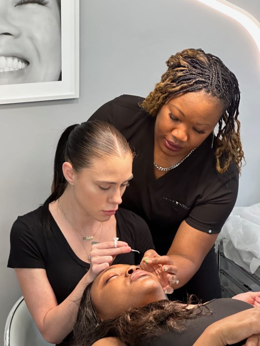 Class is in session: Lash Box owner Melesia DeChiaro leads an eyelash artistry training session at her salon.