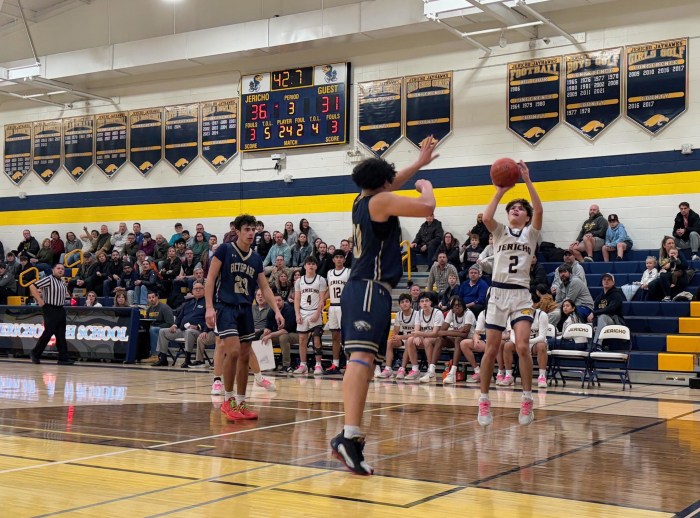 Jericho junior guard Max Deutsch shoots a J in the third quarter of a home playoff game against Bethpage.