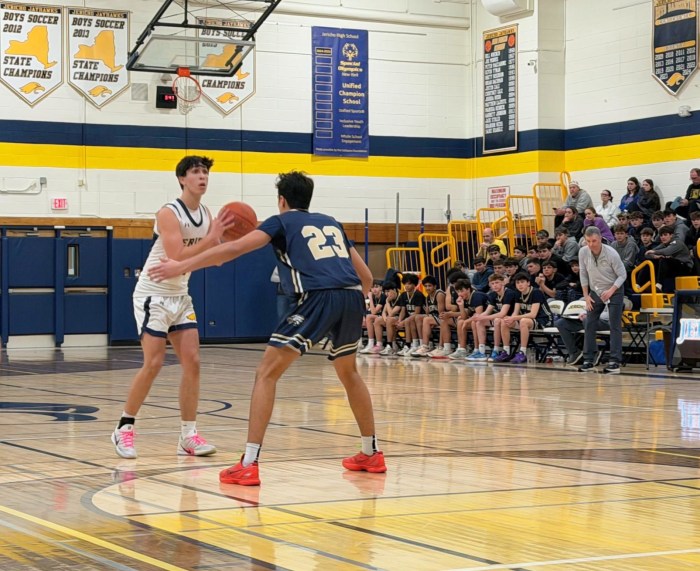Jericho senior co-captain Max Spector looks to attack from the top of the key. Spector contributed eight points in the win.