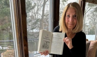 Emmi S. Herman with copies of "Chicken Soup for the Soul."