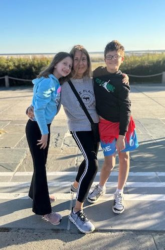 Emmi S. Herman (Center) with her two grandchildren now ages 10 and 13.