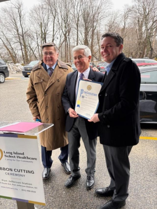 Suffolk County Executive Ed Romaine presents a Proclamation honoring LISH Care to Board Chairman John Lessard (center) and CEO Aaron Clark (right).