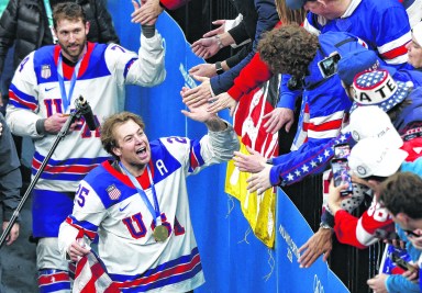 Long Island native Charlie McAvoy celebrates the U.S. Men's Hockey gold medal win at the 2026 winter Olympics.