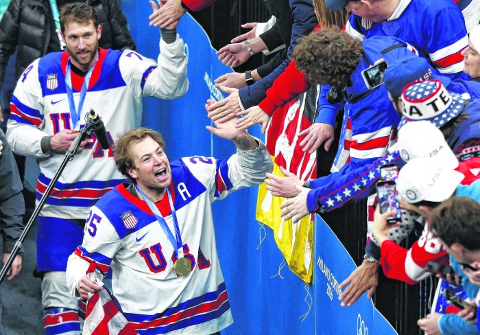 Long Island native Charlie McAvoy celebrates the U.S. Men's Hockey gold medal win at the 2026 winter Olympics.