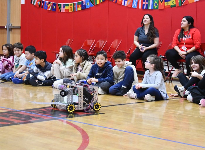 Students watched live robotics demonstrations.