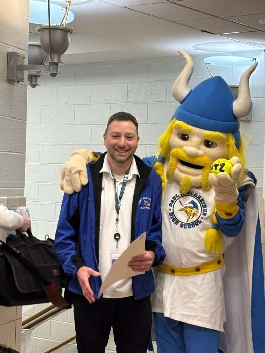 Port Washington Varsity Softball Coach Eric Sutz with the Port Washington Union Free School District mascot, a viking. 