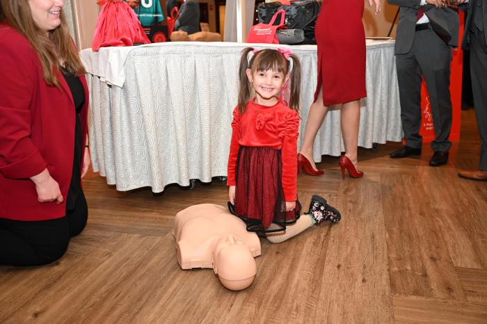 Adela, daughter of Hana Boruchov, practices hands-only CPR. At age 2, Adela’s life was saved when her mother performed CPR during a seizure.
