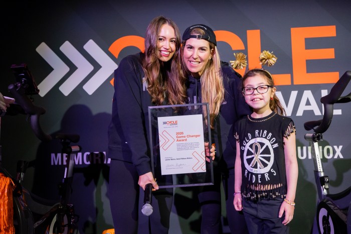 Jamie Weiss (far L.) was one of this year’s winners of Cycle for Survival’s "Game Changer Award,” an annual honor presented to a participant for their leadership, generosity and wavering dedication to Cycle for Survival. 