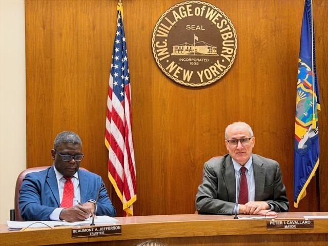 Westbury’s 2nd Deputy Mayor Beaumont Jefferson (L.) and Mayor Peter Cavallaro (R.) led the village’s board of trustees' recent meeting.