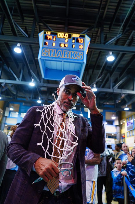 Rod Strickland, LIU's head basketball coach, celebrated the conference title.