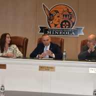 Mineola trustees at an earlier village board meeting.