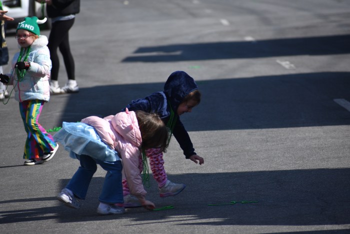 Kids along the route collected bead necklaces from parade participants.