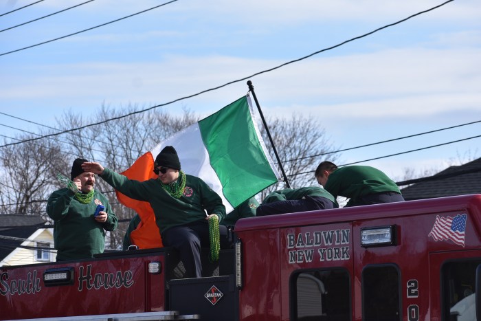 Members of the Baldwin Fire Department threw bead necklaces to kids along the route.