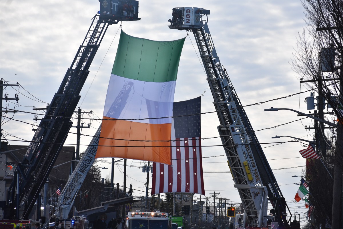 Massive flags flew over Jericho Turnpike at the Mineola St. Patrick's Day parade.