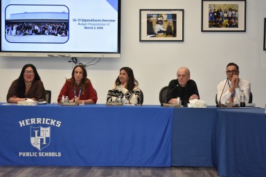 The Herricks Board of Education at its recent meeting where Trustee Henry Zanetti (Center R.) announced he will not seek reelection.