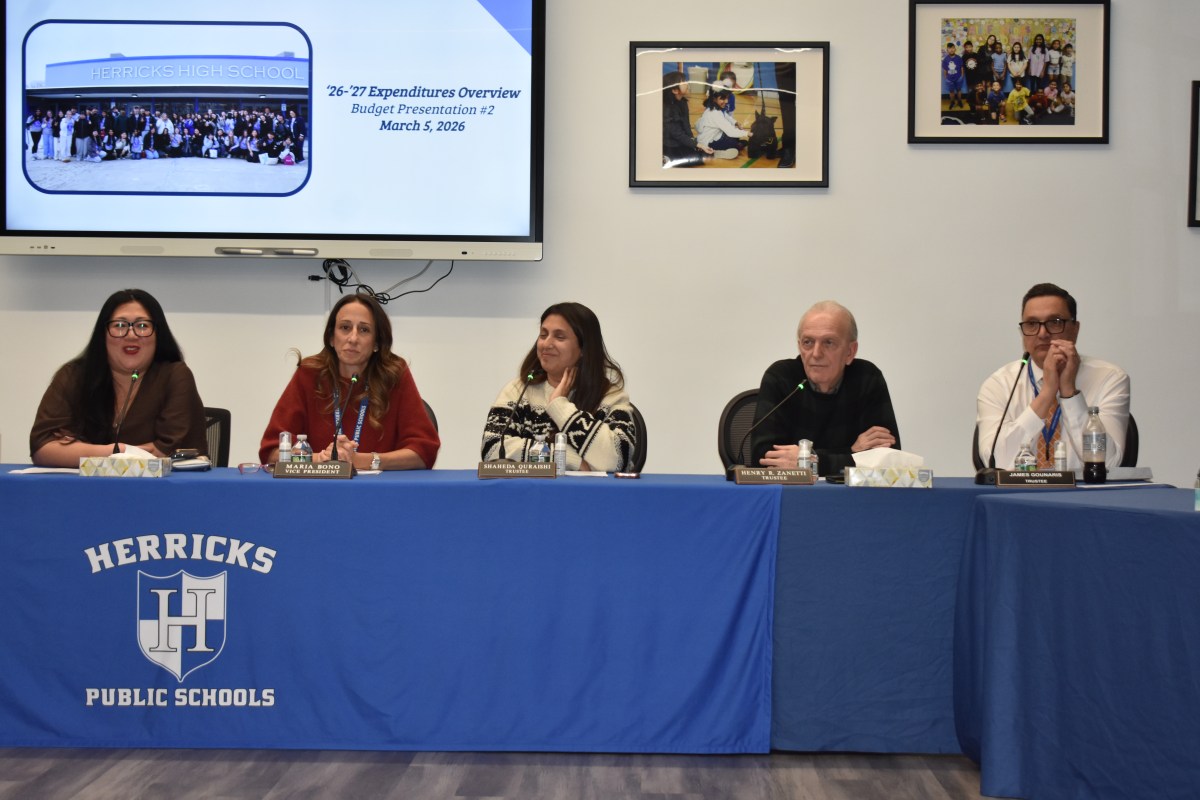 The Herricks school board at a recent meeting.