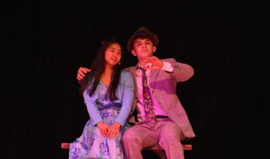 Students from the cast of "Bye Bye Birdie" performed a sond for administration, trustees and community members.