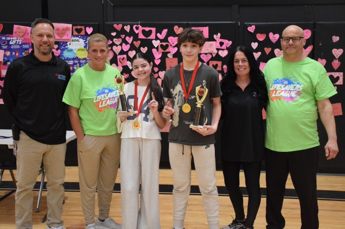 Physical education teachers Thomas Liguori, Deb DiBiase, Eileen Keener and Gary Reh (L. to R.) congratulated the overall winners Brynn Kreutzberger and Patrick O’Brien.